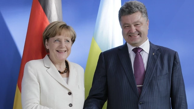 Merkel's Visit: Hope And Skepticism In Kyiv