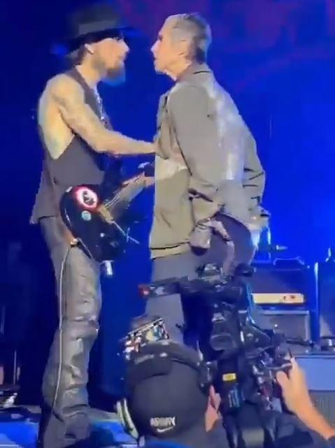 Rock band lead singer punches guitarist on stage, concert ends