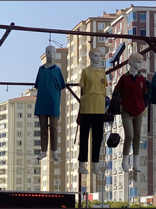 She hung mannequins dressed in school uniforms by tying ropes around their necks