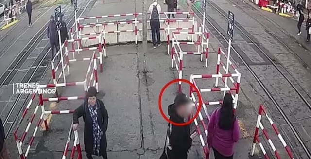 A train hit a woman crossing the tracks while looking at her phone in Argentina