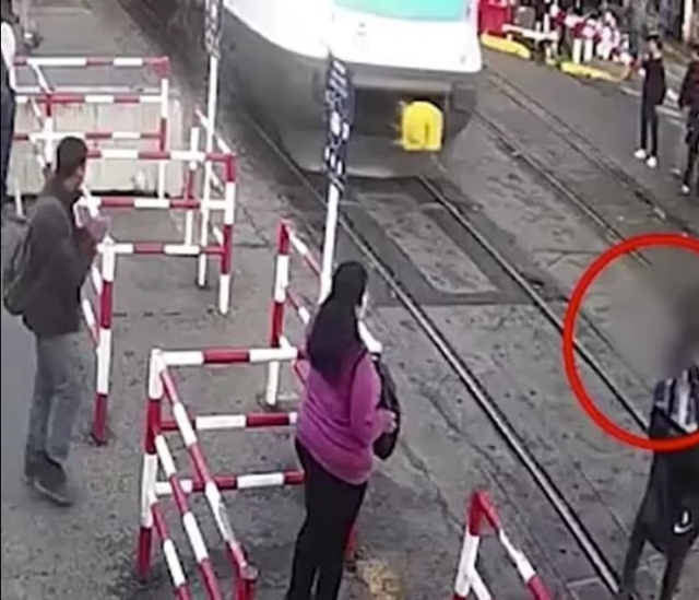 A train hit a woman crossing the tracks while looking at her phone in Argentina