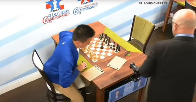 The chess master who punched a female reporter after his defeat was arrested