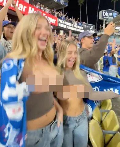 Two women showing their breasts to the cameras during the baseball game drew reactions