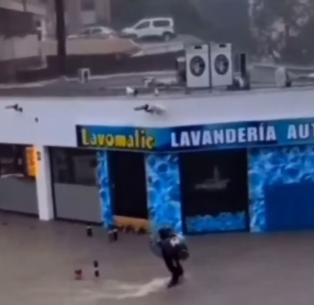 The hero man rescued the elderly woman caught in the floodwaters