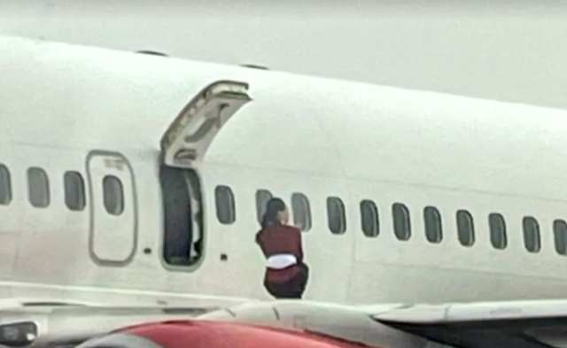 Flight attendants opened the emergency exit door and took a selfie on the wing of the plane