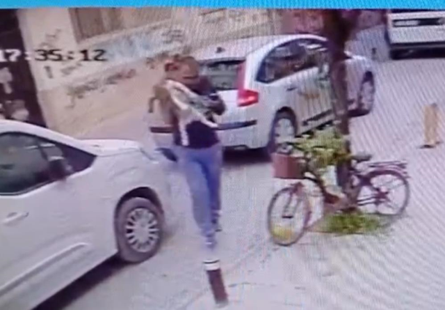 Threw the dog to the ground and squeezed its throat; those moments were captured on camera