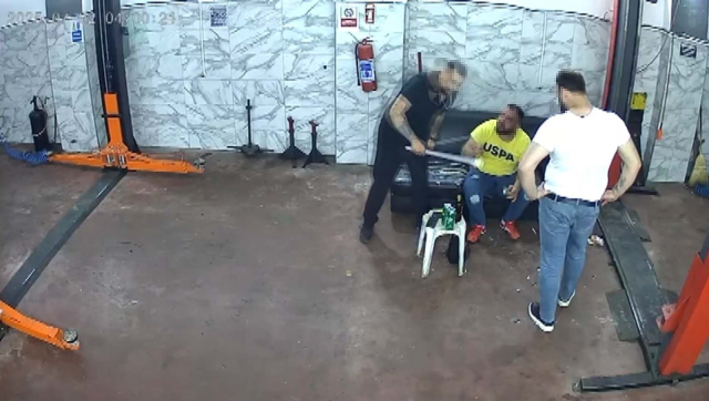 He was beaten with a crowbar at the car repair shop; those moments were recorded
