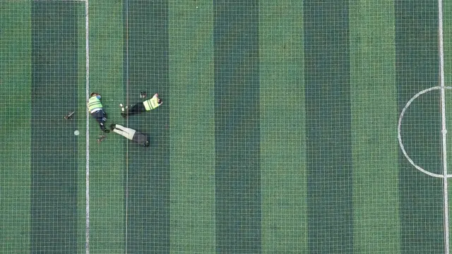 Firefighters who fought the flames for 12 hours rested like this on the field