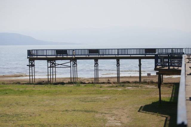 The pier where a sea bus used to dock in Lake Iznik is now stranded on land