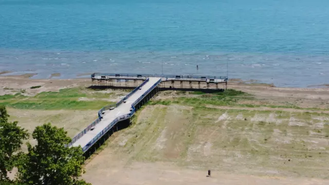 The pier where a sea bus used to dock in Lake Iznik is now stranded on land