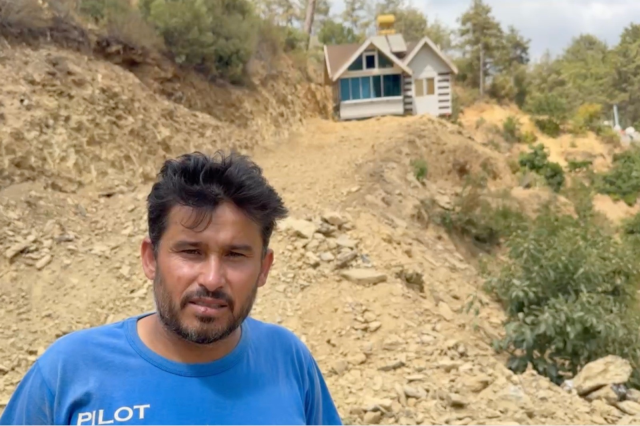 He moved his house, which received a demolition order, by walking it over the rails