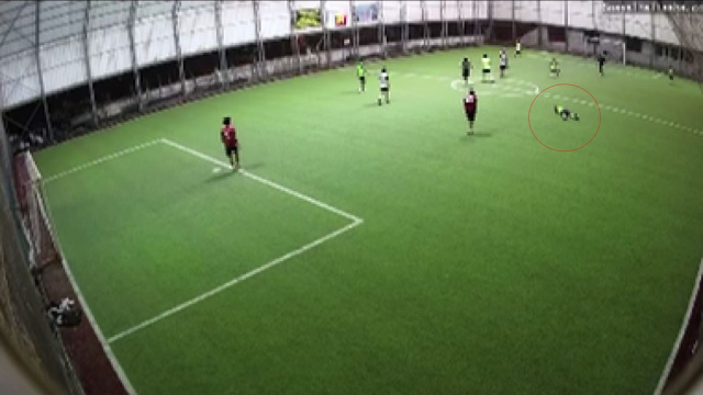 Police officer playing football on a turf field suffered a heart attack and passed away