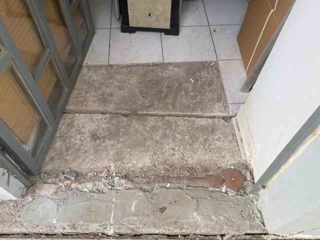 The building's columns exploded, and there are sliding and cracks on the ground