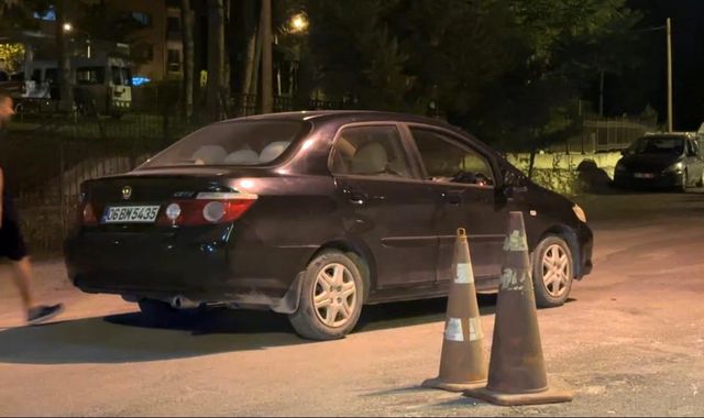 Driver blowing into breathalyzer