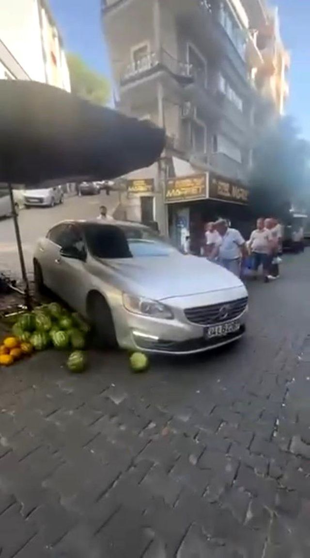 Luxury car entering market stall causing chaos
