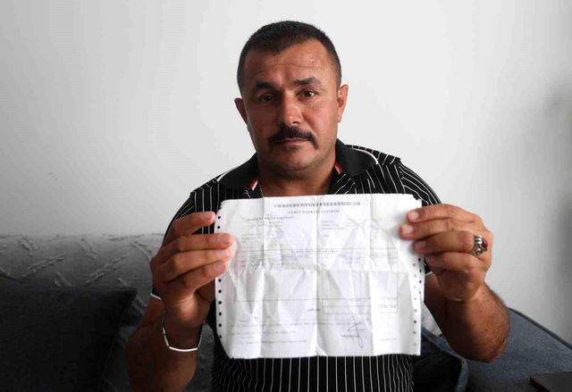 Ahmet Artan showing document