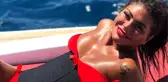 Ne yapsa olmuyor! Bikinisiyle sahilde defile yapan Süreyya Yalçın'a takipçilerinden tepki