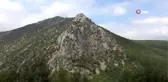 Dağ yüzeyindeki insan silueti dikkat çekiyor