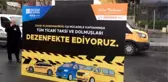 İstanbul'da Harem'de kurulan istasyonda taksi ve dolmuşlar dezenfekte ediliyor