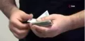 Para dolu cüzdanı sahibine teslim etti