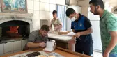 İhtiyaç sahiplerinin borçlarının yazıldığı defter yaprakları fırında yandı