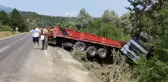 Kayganlaşan yolda şarampole uçan tırdan yara almadan kurtuldu