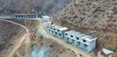 Yusufeli'nde yangınzedeler için inşa edilen afet konutları hızla yükseliyor