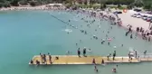 Sıcaktan bunalanlar Hazar Gölü'ne akın etti, plajlar Ege ve Akdeniz'i aratmadı