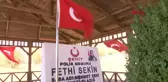 FETHİ SEKİN'İN ŞEHİT OLDUĞU İZMİR'DEN ALDIĞI BAYRAĞI, BİN 500 KİLOMETRE BİSİKLET SÜREREK KABRİNE ULAŞTIRDI
