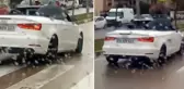 Milyonluk arabada ıslanmamak için şemsiye açtı