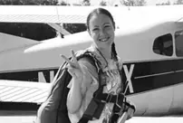 A woman who was struck by an airplane propeller while taking a photograph has lost her life.