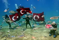 They celebrated the 101st anniversary of the Republic in the depths of the sea.