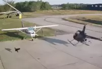 The helicopter collided with a parked plane: The pilot escaped uninjured.