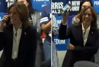 Harris, who claimed to be speaking with a voter on the phone, was caught off guard by the cameras.