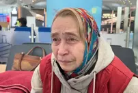 An elderly woman who has been stranded at Istanbul Airport for weeks is waiting for help.