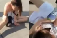 She brutally beat her husband's mistress in the middle of the street and tore her clothes.