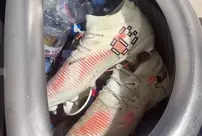 The star football player threw his boots in the trash.