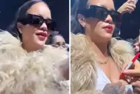 Rihanna opened her shirt at the concert and had Mariah Carey sign it.