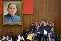 In the Taiwanese parliament, chairs flew through the air.