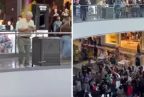 The elderly man distributing money in the shopping mall caused a stampede.