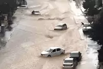 Mecca is underwater! Vehicles and trash containers were swept away like toys.