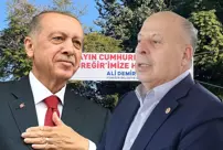 The CHP mayor who met with President Erdoğan holds a banner reading 'Erdoğan'.