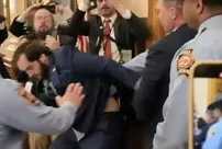 The senator who tried to force his way into the parliament was taken into custody by the police.