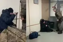 Images have emerged showing a Russian commander torturing an injured soldier.