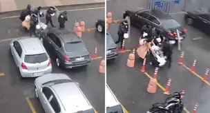 The police protected the mother and her baby from the storm with a shield.