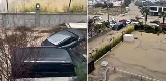 Kuşadası sele teslim! Sokaklar göle döndü, araçlar böyle sürüklendi Kuşadası sele teslim! Sokaklar göle döndü, araçlar böyle sürüklendi