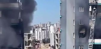 Apartmanda çıkan yangında mahsur kalan baba ve bebeğini inşaat işçisi kurtardı