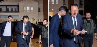 Ertoşi aşiretinin lideri İskender Ertuş aracından iner inmez deste deste para dağıttı