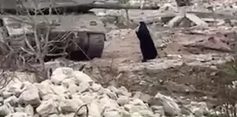 A Lebanese woman stood in front of the tanks and challenged the Israeli soldiers.