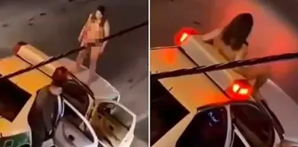 An interesting protest in Iran: A woman climbed onto a police vehicle naked.